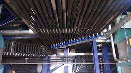 Paint pipes are leaving from the distribution groups, going around in the factory, up to the delivery stations with pressure regulators, and then coming back in the paint mixroom and the production tanks through the BPR and bag filter. Paint pipes are leaving from the distribution groups, going around in the factory, up to the delivery stations with pressure regulators, and then coming back in the paint mixroom and the production tanks through the BPR and bag filter.