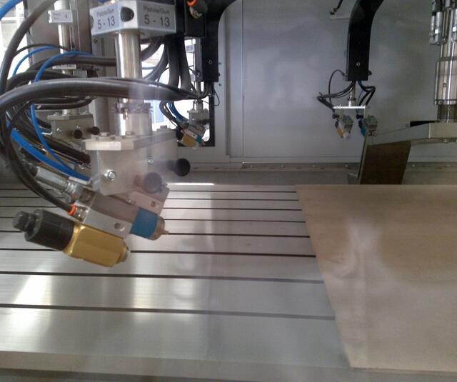Automatic airspray gun on flat line Automatic airspray gun on flat line